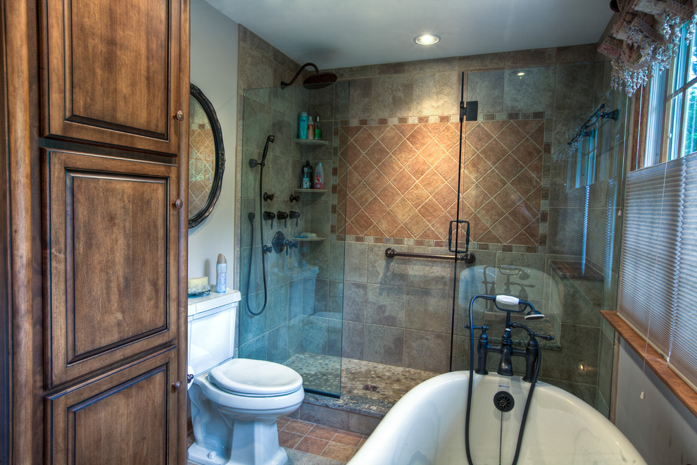 Bathroom - mid-sized rustic master brown tile and porcelain tile porcelain tile bathroom idea in Bridgeport with an undermount sink, raised-panel cabinets, medium tone wood cabinets, granite countertops, a two-piece toilet and beige walls