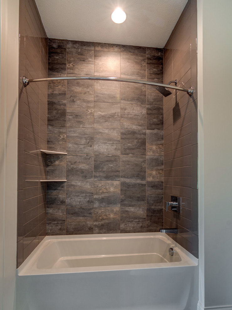 Large farmhouse 3/4 brown tile and ceramic tile ceramic tile and gray floor bathroom photo in Indianapolis with shaker cabinets, black cabinets, a one-piece toilet, white walls and a drop-in sink
