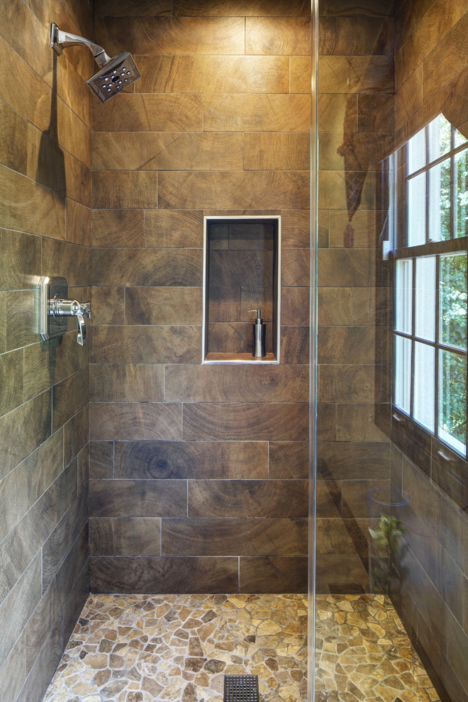 Small rustic shower room bathroom in Chicago with flat-panel cabinets, distressed cabinets, an alcove shower, brown tiles, porcelain tiles, beige walls, a vessel sink, quartz worktops and a hinged door.