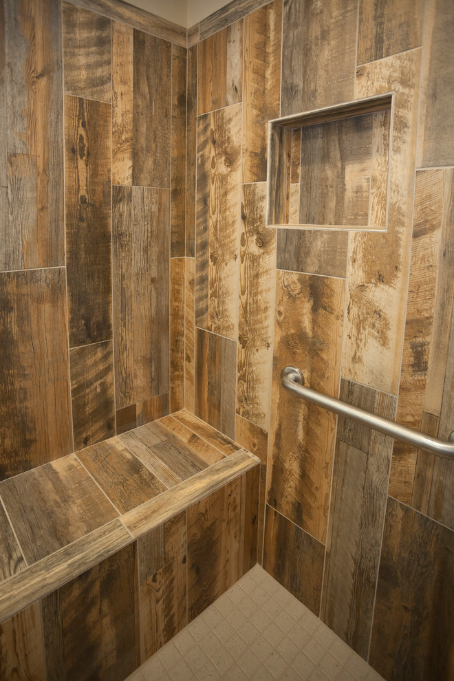 Inspiration for a medium sized rustic ensuite bathroom in Dallas with shaker cabinets, light wood cabinets, an alcove shower, a two-piece toilet, brown tiles, porcelain tiles, beige walls, porcelain flooring, a vessel sink and granite worktops.