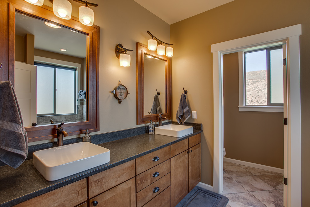 Photo of a medium sized rustic ensuite bathroom in Seattle with shaker cabinets, medium wood cabinets, beige walls, ceramic flooring, a built-in sink, laminate worktops and beige floors.