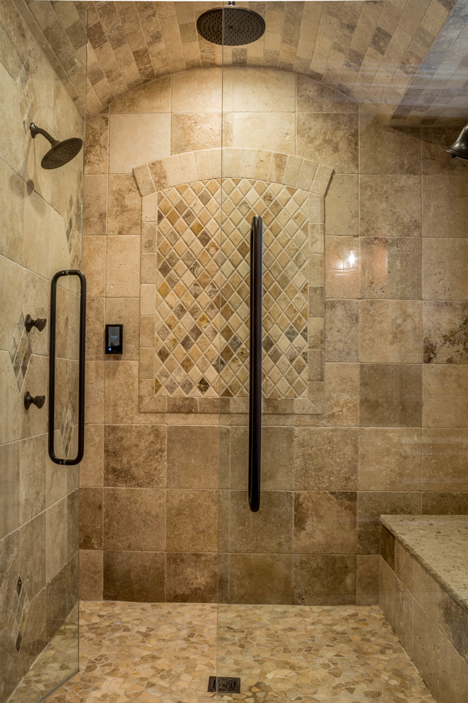 Walk-in shower - large rustic master beige tile and subway tile ceramic tile and beige floor walk-in shower idea in Detroit with raised-panel cabinets, medium tone wood cabinets, an undermount tub, a two-piece toilet, beige walls, an undermount sink, quartz countertops and a hinged shower door