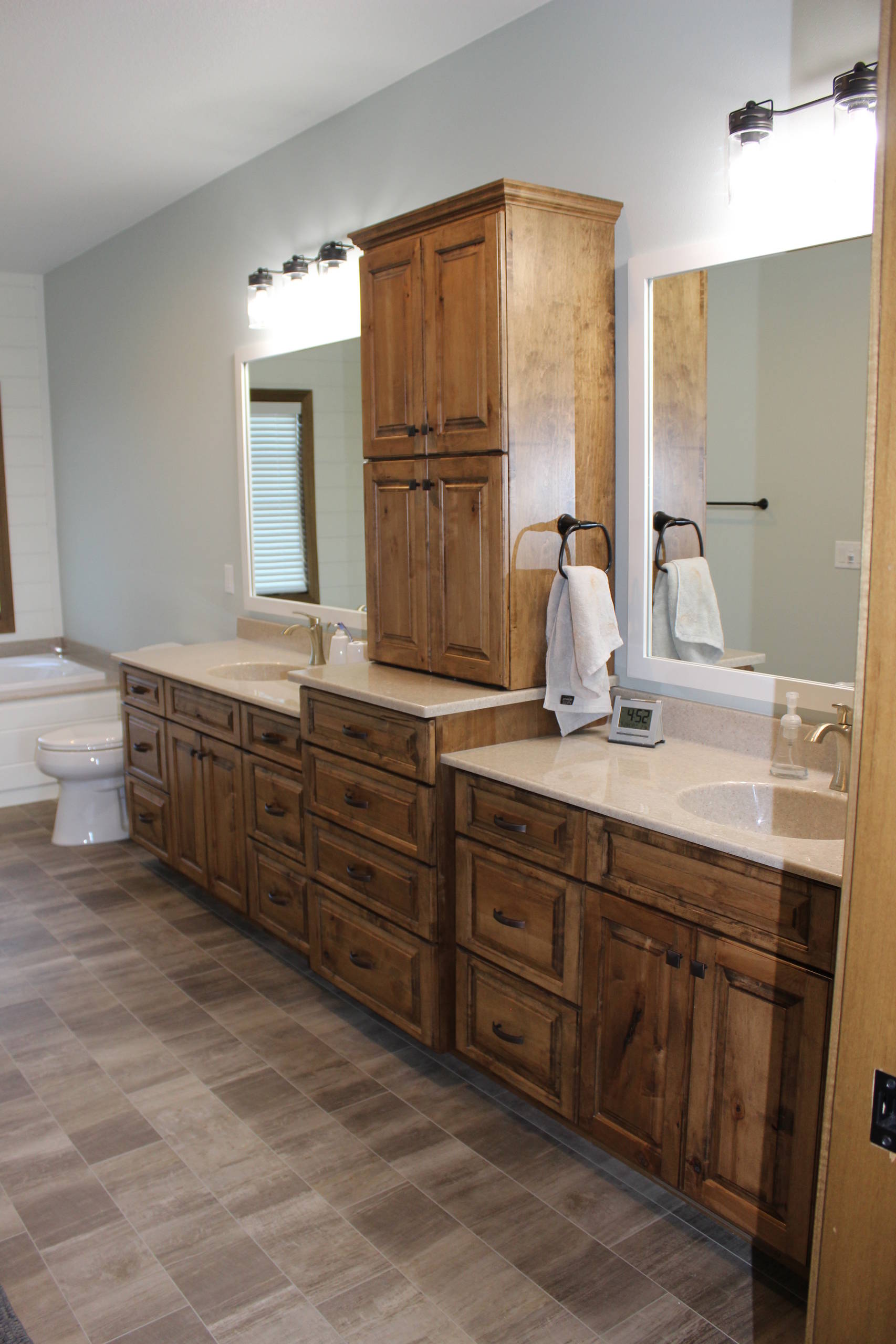 bathroom with maple cabinets