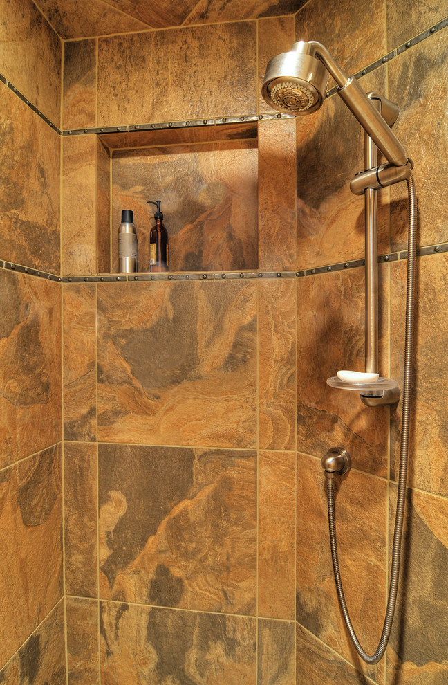 Example of a mid-sized mountain style master multicolored tile and porcelain tile slate floor doorless shower design in Seattle with a vessel sink, flat-panel cabinets, medium tone wood cabinets, concrete countertops, a two-piece toilet and green walls