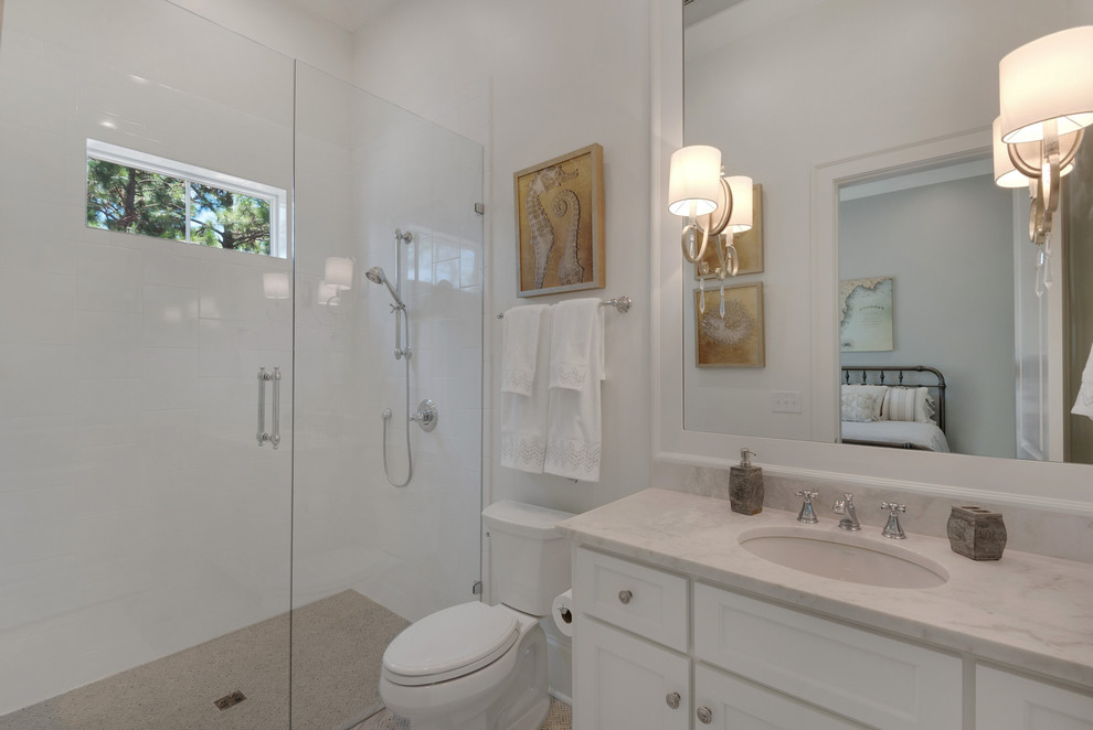 Example of a large country multicolored tile and ceramic tile linoleum floor alcove shower design in Other with recessed-panel cabinets, white cabinets, a one-piece toilet, white walls, an undermount sink and marble countertops