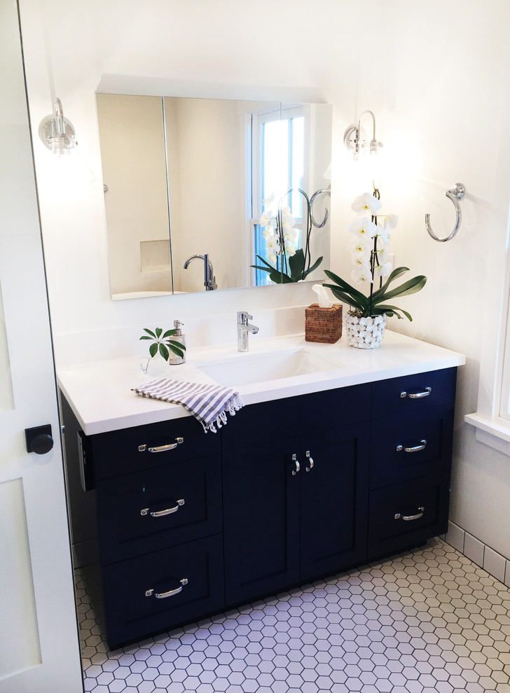 Inspiration for a mid-sized transitional master white tile and porcelain tile porcelain tile bathroom remodel in Santa Barbara with shaker cabinets, blue cabinets, a one-piece toilet, white walls, an undermount sink and quartz countertops