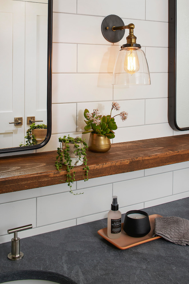 Inspiration for a mid-sized rustic master white tile and subway tile porcelain tile and black floor bathroom remodel in San Francisco with white walls and an undermount sink