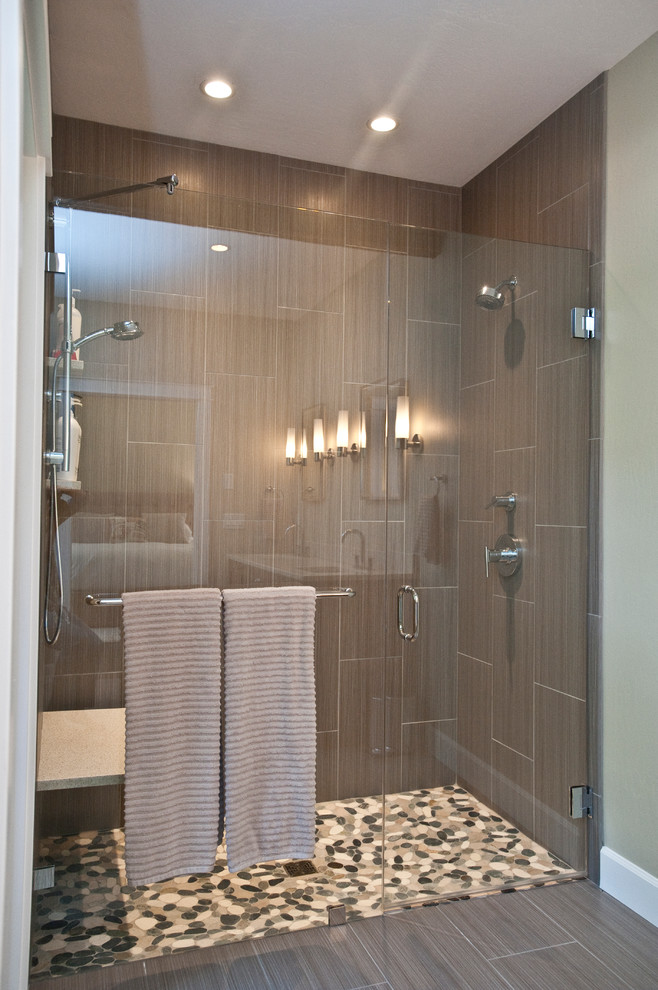Inspiration for a mid-sized transitional master gray tile and ceramic tile porcelain tile and brown floor bathroom remodel in Other with flat-panel cabinets, medium tone wood cabinets, a one-piece toilet, beige walls, an undermount sink, quartzite countertops and a hinged shower door