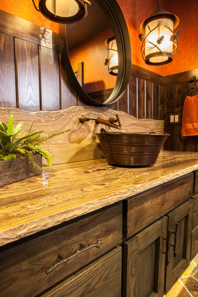 Medium sized rustic bathroom in Other with freestanding cabinets, green cabinets, a built-in bath, a shower/bath combination, a two-piece toilet, orange walls, a vessel sink and quartz worktops.