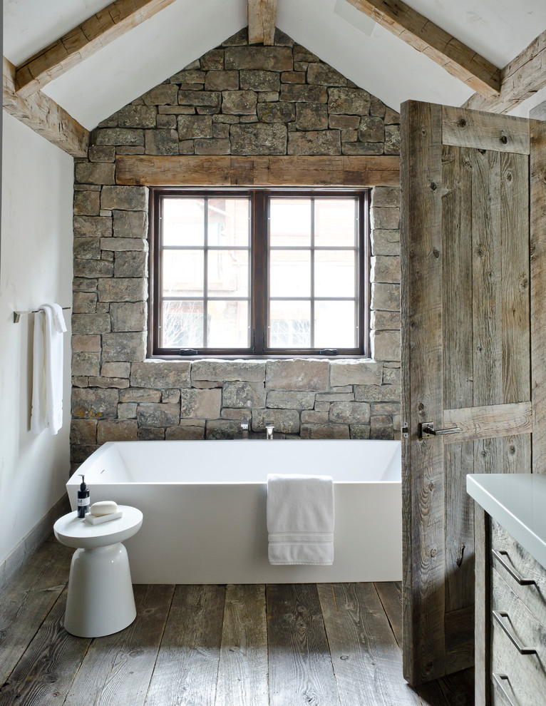 This is an example of a rustic bathroom in Other with a freestanding bath.