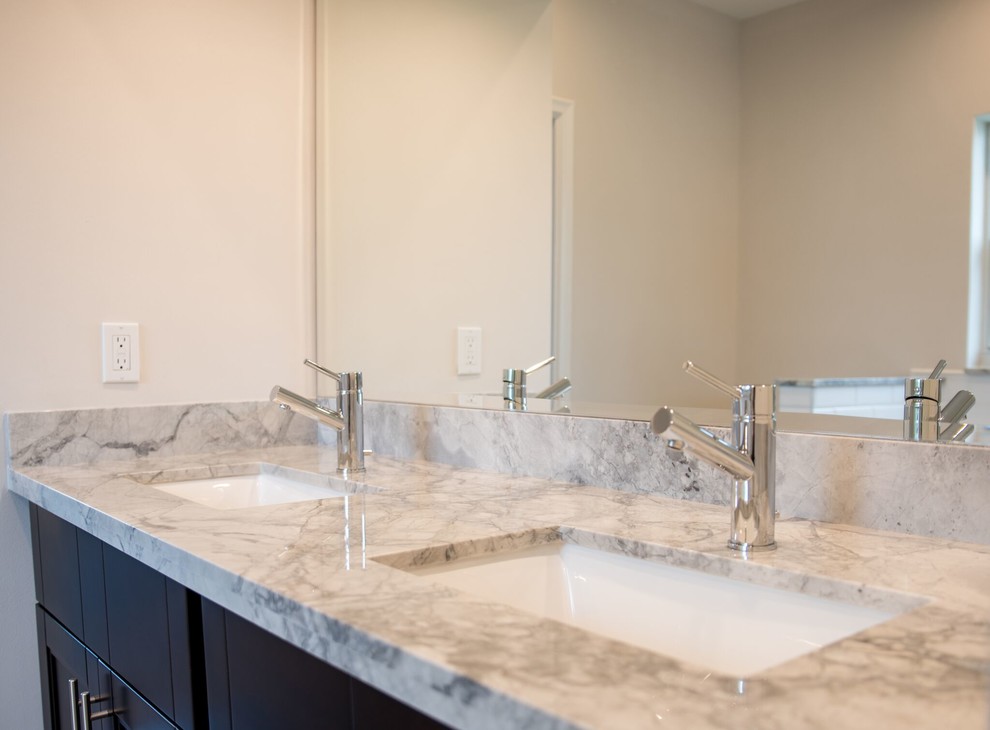 Inspiration for a medium sized classic ensuite bathroom in Columbus with shaker cabinets, dark wood cabinets, a built-in bath, a corner shower, a two-piece toilet, beige walls, a submerged sink, marble worktops, white tiles, metro tiles, medium hardwood flooring, brown floors and a hinged door.