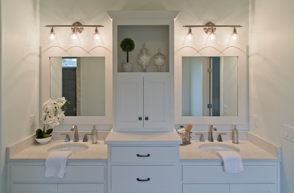 Inspiration for a large coastal master ceramic tile and beige floor bathroom remodel in Kansas City with shaker cabinets, white cabinets, white walls, an undermount sink and a hinged shower door