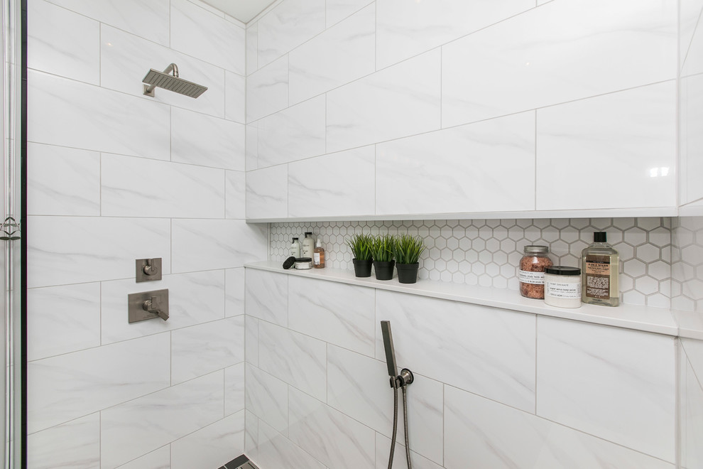 Example of a mid-sized minimalist master white tile and porcelain tile porcelain tile and black floor bathroom design in Ottawa with flat-panel cabinets, white cabinets, a one-piece toilet, gray walls, an integrated sink and white countertops