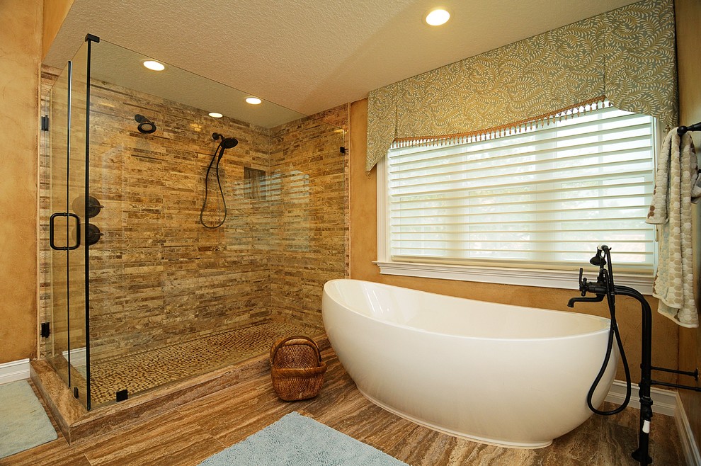 Idéer för mellanstora vintage en-suite badrum, med luckor med infälld panel, beige skåp, ett fristående badkar, en hörndusch, beige väggar, ett undermonterad handfat, granitbänkskiva, blå kakel, stickkakel, mellanmörkt trägolv, brunt golv och dusch med gångjärnsdörr