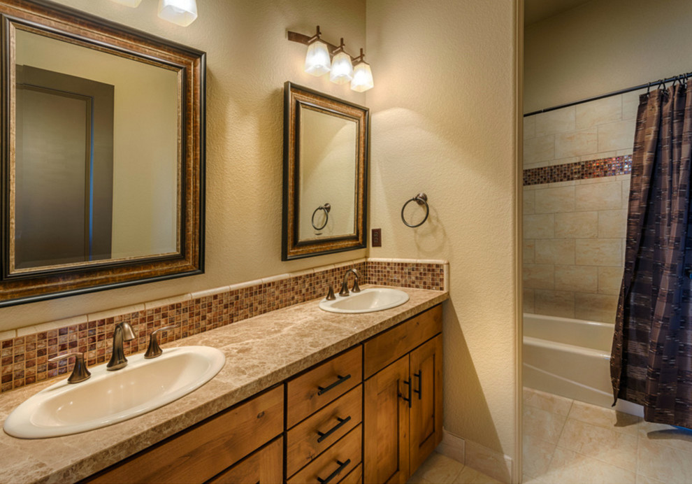 Mid-sized mountain style master beige tile and ceramic tile ceramic tile and beige floor bathroom photo in Other with shaker cabinets, medium tone wood cabinets, beige walls, a drop-in sink and quartz countertops