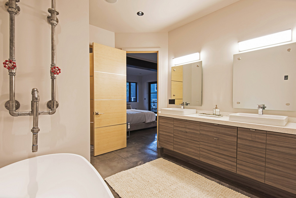 Photo of a medium sized contemporary ensuite bathroom in Salt Lake City with flat-panel cabinets, medium wood cabinets, a freestanding bath, an alcove shower, beige tiles, glass tiles, a vessel sink and an open shower.