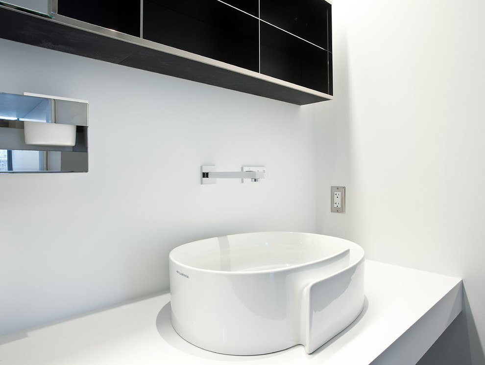 Example of a large minimalist master white tile and porcelain tile concrete floor and gray floor bathroom design in Salt Lake City with flat-panel cabinets, white cabinets, a one-piece toilet, white walls, a vessel sink and quartz countertops