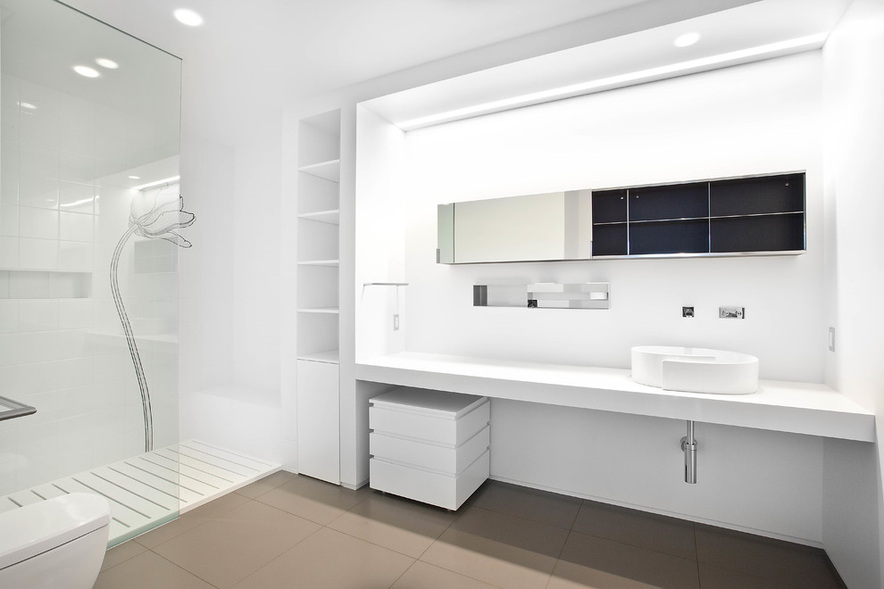 Bathroom - large modern 3/4 white tile and porcelain tile porcelain tile and gray floor bathroom idea in Salt Lake City with flat-panel cabinets, white cabinets, a one-piece toilet, white walls, a vessel sink and quartz countertops