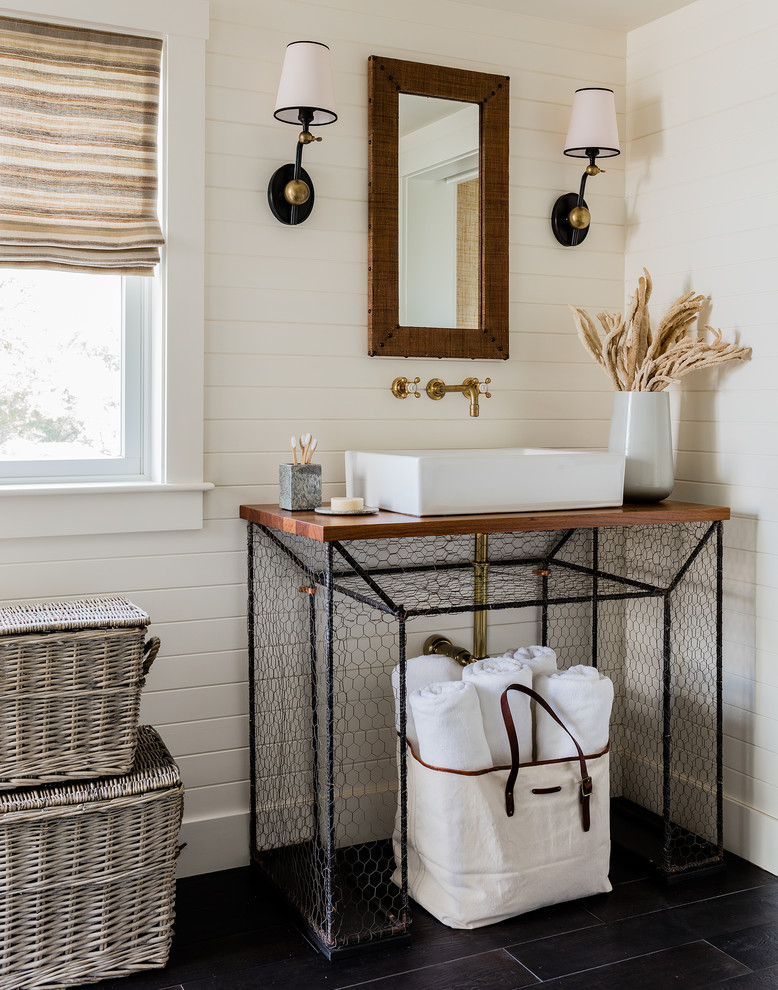 Transitional master ceramic tile and black floor doorless shower photo in Boston with open cabinets, white walls, a vessel sink and wood countertops