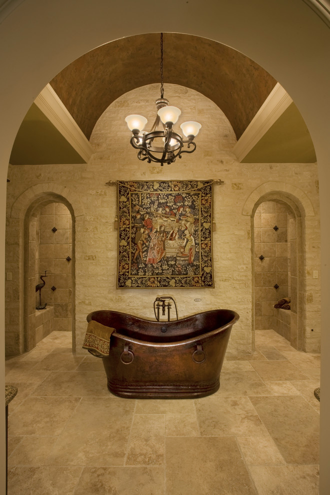 Elegant beige tile freestanding bathtub photo in Austin