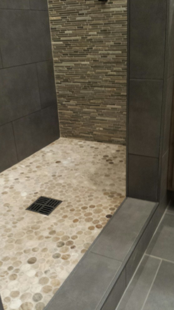 Design ideas for a large contemporary ensuite bathroom in San Francisco with a shower/bath combination, porcelain tiles, pebble tile flooring, a built-in bath, grey tiles, beige walls and engineered stone worktops.
