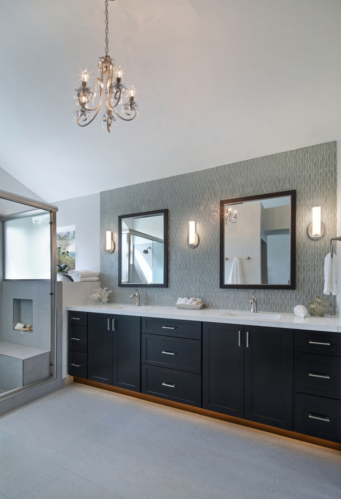 Mid-sized transitional master gray tile and glass tile porcelain tile and gray floor bathroom photo in Orange County with shaker cabinets, dark wood cabinets, a one-piece toilet, gray walls, an undermount sink and quartz countertops