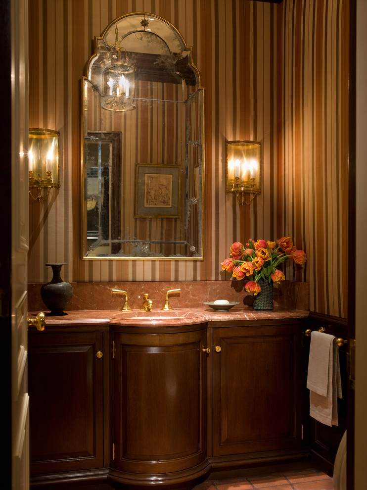 Traditional bathroom in San Francisco with a submerged sink, raised-panel cabinets and dark wood cabinets.