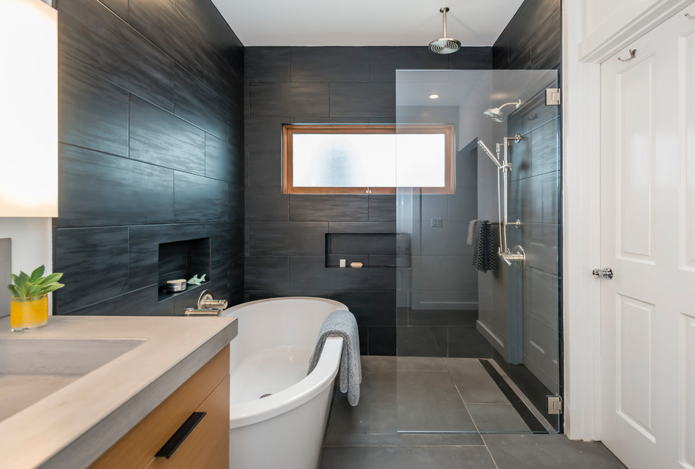 Example of a mid-sized trendy master black tile and ceramic tile cement tile floor and gray floor bathroom design in San Francisco with flat-panel cabinets, light wood cabinets, a one-piece toilet, white walls, a wall-mount sink and concrete countertops