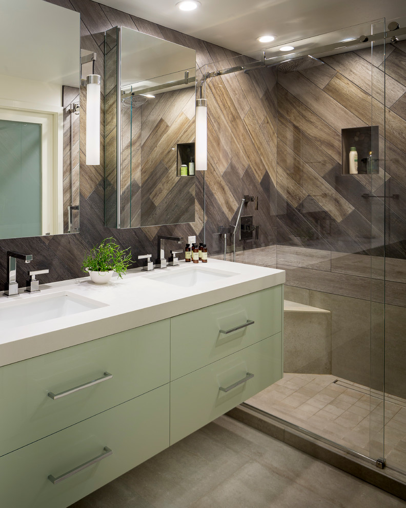 Contemporary shower room bathroom in San Francisco with glass-front cabinets, white cabinets, a walk-in shower, brown tiles, wood-effect tiles, brown walls, an integrated sink, solid surface worktops, a sliding door, white worktops, a wall niche, a shower bench, double sinks, a floating vanity unit, panelled walls and wood walls.