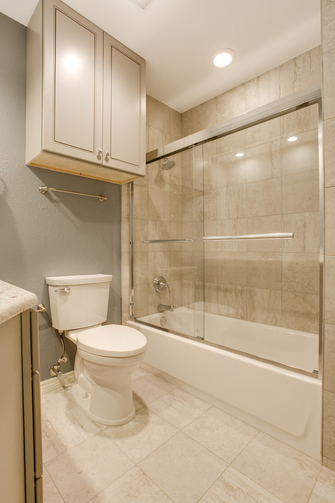 Example of a small classic 3/4 ceramic tile ceramic tile bathroom design in Dallas with flat-panel cabinets, beige cabinets, an undermount tub, gray walls and granite countertops
