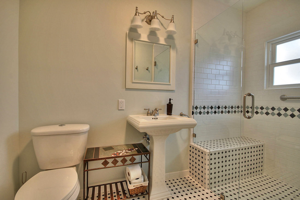 Medium sized traditional shower room bathroom in San Francisco with a pedestal sink, a built-in shower, a two-piece toilet, white tiles, metro tiles and green walls.
