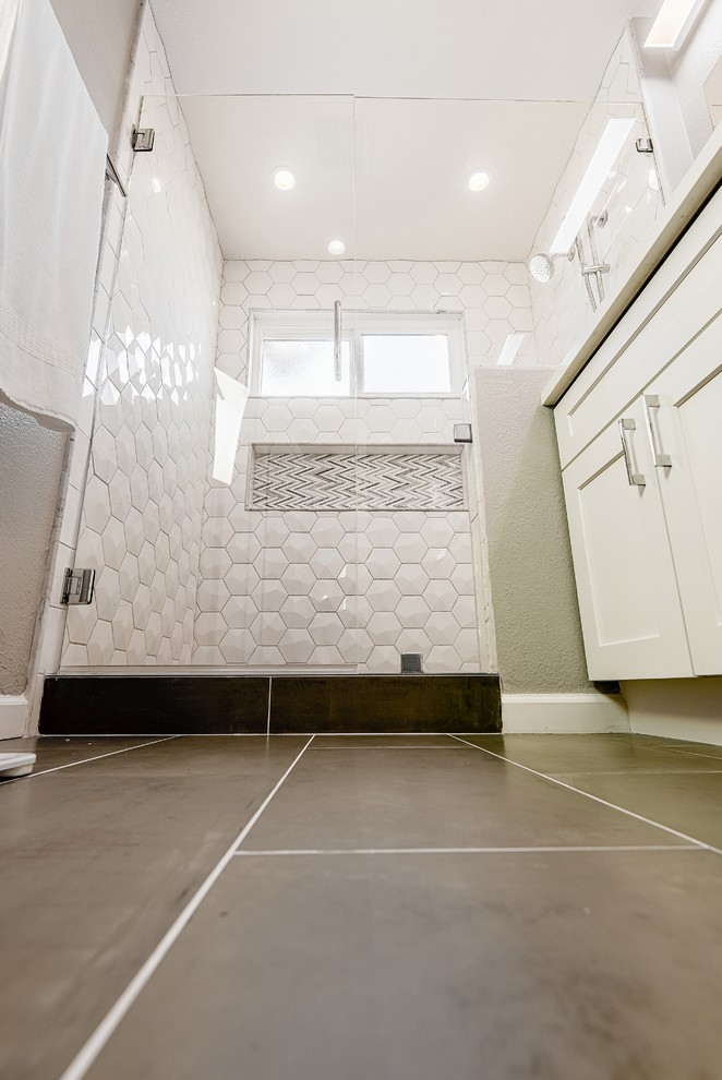 Example of a mid-sized minimalist master white tile and porcelain tile porcelain tile double shower design in San Francisco with shaker cabinets, white cabinets, a two-piece toilet, gray walls, an undermount sink and quartz countertops