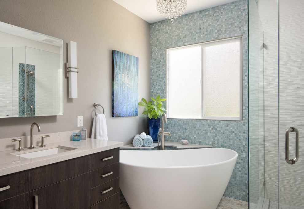 Inspiration for a large modern master multicolored tile and porcelain tile porcelain tile and double-sink bathroom remodel in San Diego with flat-panel cabinets, dark wood cabinets, a two-piece toilet, beige walls, quartzite countertops, a wall-mount sink, a hinged shower door, white countertops and a built-in vanity