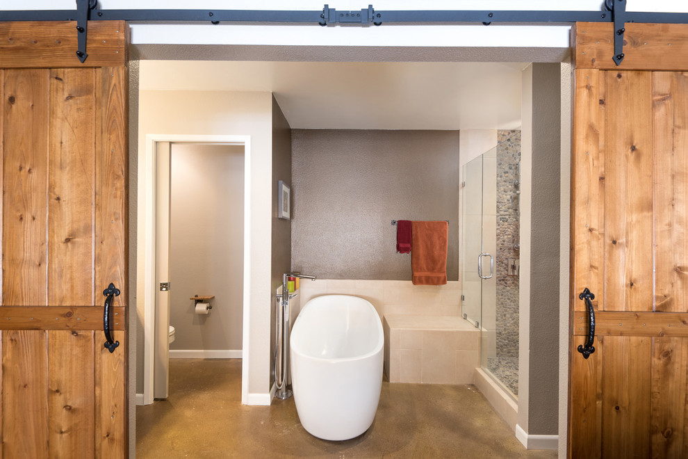 Large mountain style master brown tile and porcelain tile concrete floor bathroom photo in San Diego with raised-panel cabinets, medium tone wood cabinets, a one-piece toilet, brown walls, an undermount sink and quartz countertops