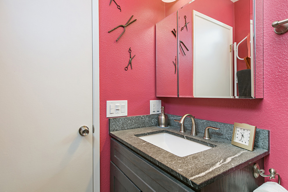 This is an example of a medium sized classic ensuite bathroom in San Diego with recessed-panel cabinets, grey cabinets, an alcove shower, a two-piece toilet, grey tiles, porcelain tiles, pink walls, porcelain flooring, grey floors, a sliding door, a submerged sink, engineered stone worktops, grey worktops, a single sink and a built in vanity unit.