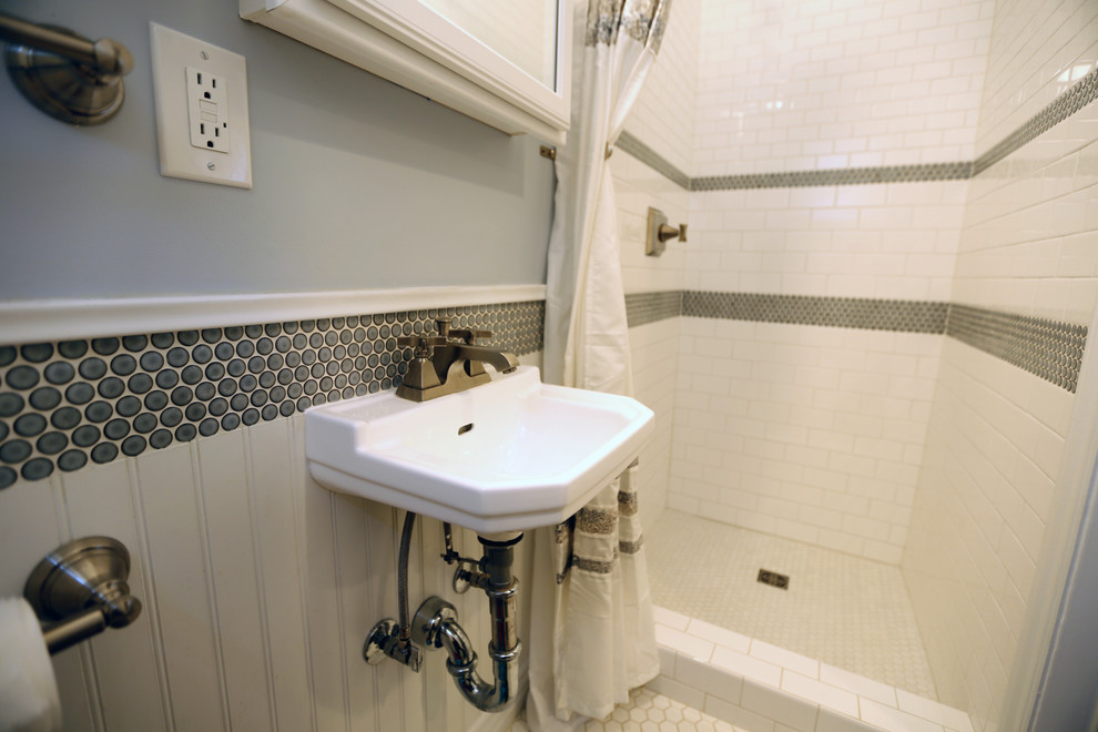 Inspiration for a timeless white tile and ceramic tile alcove shower remodel in Los Angeles with a wall-mount sink