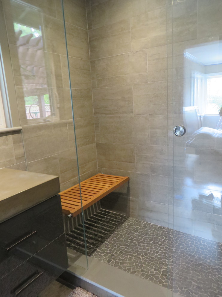 Inspiration for a mid-sized contemporary master bathroom remodel in San Francisco with an integrated sink, flat-panel cabinets, concrete countertops and a wall-mount toilet