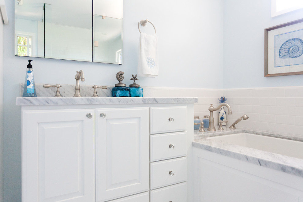 Inspiration for a large timeless master white tile and subway tile bathroom remodel in Santa Barbara with white cabinets, an undermount tub and blue walls