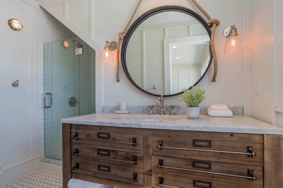 Example of a small beach style white tile and porcelain tile porcelain tile alcove shower design in Miami with furniture-like cabinets, medium tone wood cabinets, white walls, a console sink and marble countertops