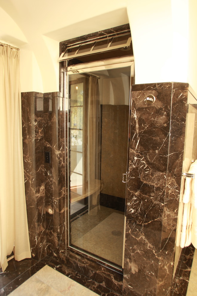 Example of a large classic master brown tile and stone slab marble floor alcove shower design in Los Angeles with white walls