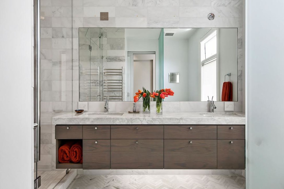 Mid-sized trendy master gray tile, white tile and marble tile marble floor and white floor alcove shower photo in San Francisco with flat-panel cabinets, dark wood cabinets, white walls, an undermount sink, marble countertops and a hinged shower door