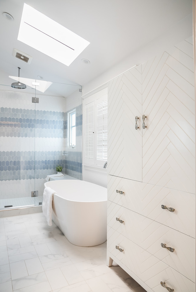 Mid-sized beach style master yellow tile and ceramic tile white floor and double-sink freestanding bathtub photo in Los Angeles with beaded inset cabinets, blue cabinets, white walls, an undermount sink, a hinged shower door, white countertops and a built-in vanity