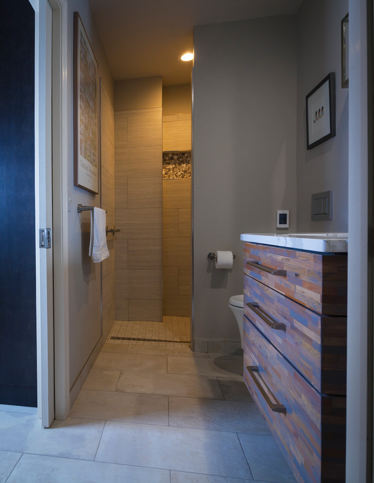 Small urban gray tile and porcelain tile porcelain tile and black floor bathroom photo in Detroit with flat-panel cabinets, medium tone wood cabinets, quartzite countertops, a wall-mount toilet, gray walls and an undermount sink