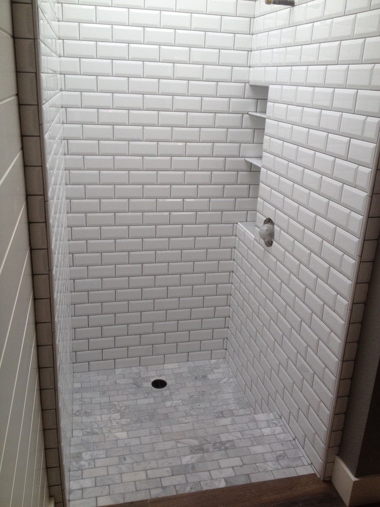 Example of a mid-sized transitional master white tile and subway tile marble floor walk-in shower design in Orange County with furniture-like cabinets, distressed cabinets, a two-piece toilet, white walls, an undermount sink and marble countertops