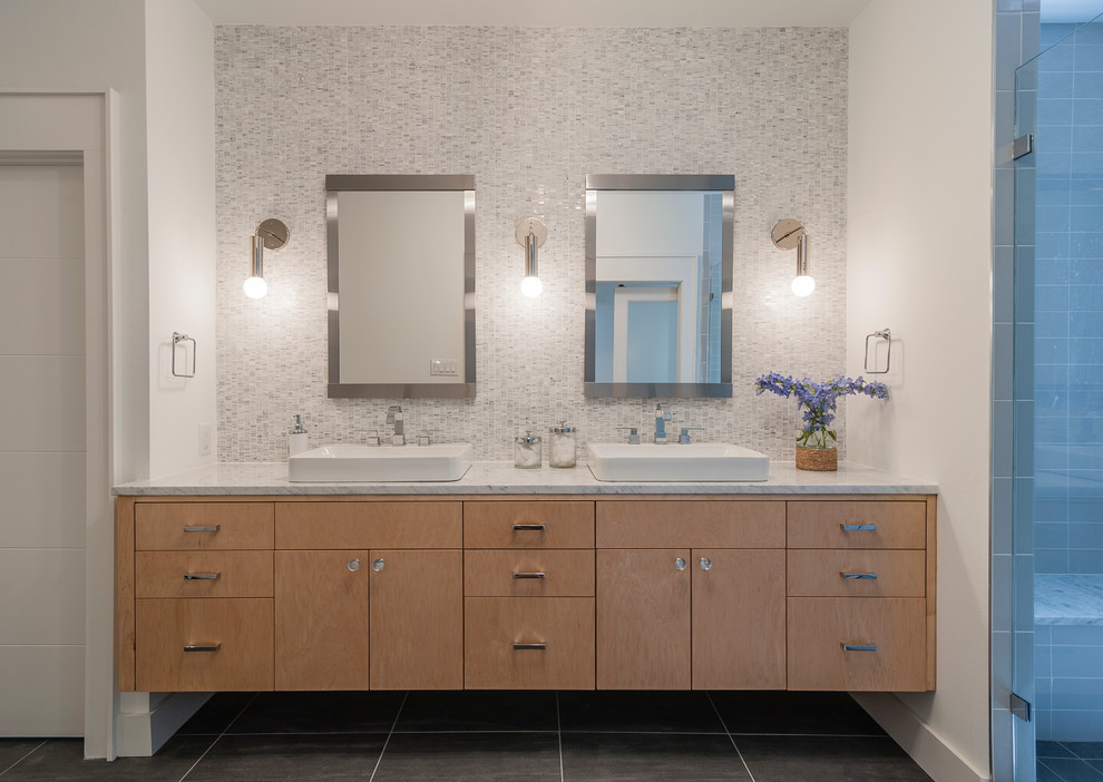 Traditional bathroom in Dallas with a vessel sink, flat-panel cabinets, medium wood cabinets, an alcove shower, white tiles, mosaic tiles and white walls.
