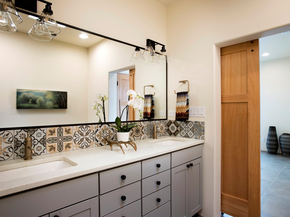 Mid-sized southwest master porcelain tile and gray floor bathroom photo in Albuquerque with flat-panel cabinets, gray cabinets, quartz countertops and white countertops
