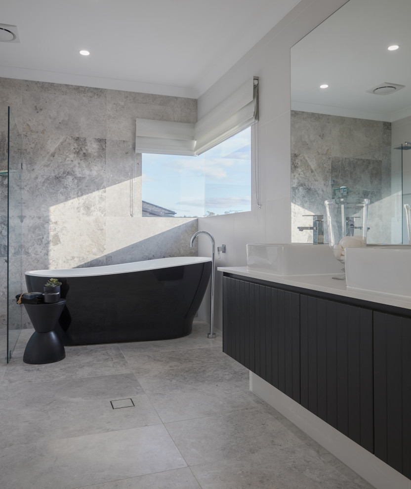 Inspiration for a medium sized contemporary ensuite bathroom in Sydney with a freestanding bath, an open shower and double sinks.