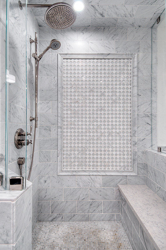 Inspiration for a mid-sized transitional master white tile and stone tile marble floor bathroom remodel in San Francisco with recessed-panel cabinets, white cabinets, a one-piece toilet, an undermount sink, quartz countertops and white walls