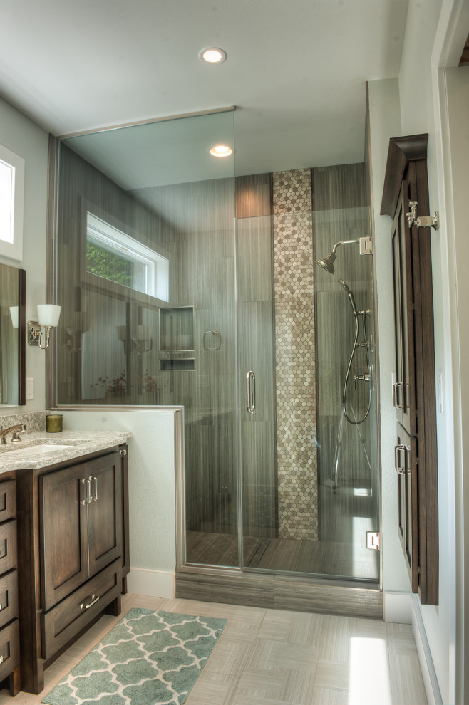 Example of a mid-sized trendy master beige tile and multicolored tile alcove shower design in Other with recessed-panel cabinets, dark wood cabinets, an undermount sink and quartzite countertops