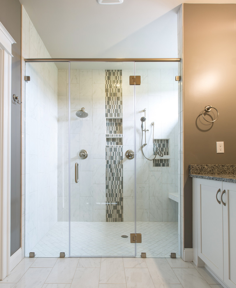 Example of a mid-sized arts and crafts master black and white tile and porcelain tile porcelain tile walk-in shower design in Other with recessed-panel cabinets, white cabinets, a one-piece toilet, gray walls, an undermount sink and granite countertops